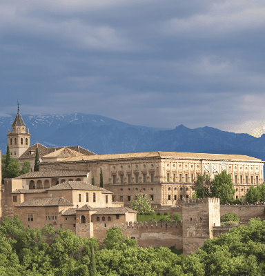 Alhambra Palace in Granada with Sierra Nevada mountains - Andalucia Tours private tours in Andalusia