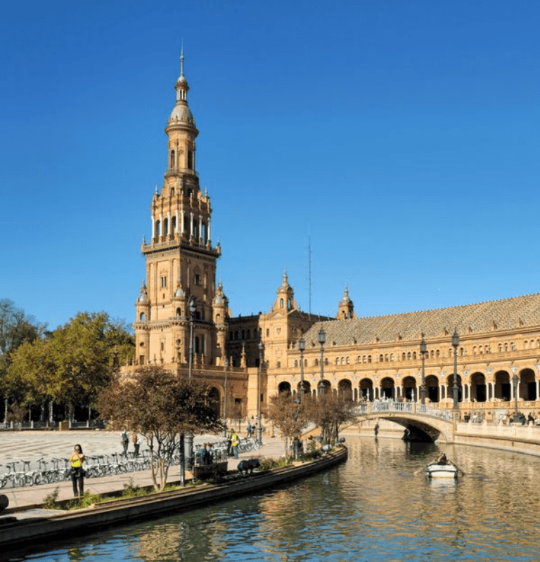 Plaza de Espana in Seville with tower, bridge and canal boats - Andalusia Tours Seville private tours