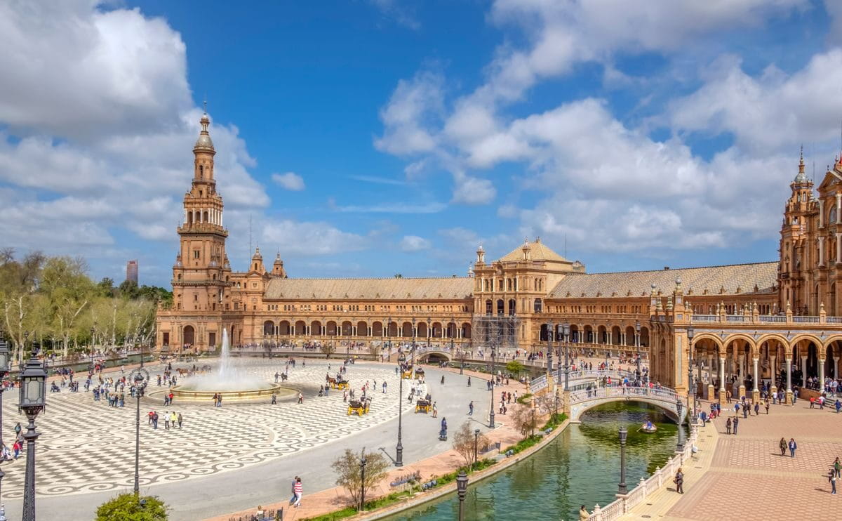 Iconic destinations in Andalusia including Seville, Granada, Ronda, white villages, and Mediterranean beaches