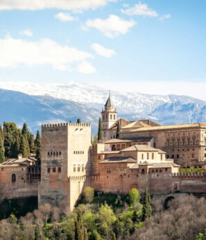 Scenic view of Andalusia featuring white villages, historic landmarks, mountains, and Mediterranean coastline in southern Spain
