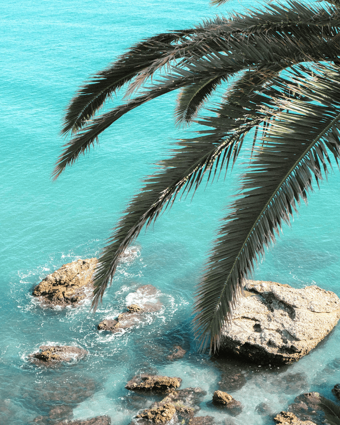 Golden sand and clear Mediterranean water at Playa de Burriana in Nerja, Costa del Sol