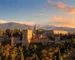 Alhambra Palace in Granada at sunset with snow-capped Sierra Nevada mountains - book Alhambra tickets in advance