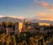 Alhambra Palace in Granada at sunset with snow-capped Sierra Nevada mountains - book Alhambra tickets in advance