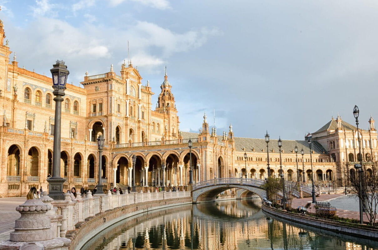 Canal and ornate architecture at Plaza de España in Seville, Spain