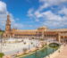 Plaza de España Seville canal with bridge, boats and fountain in María Luisa Park 2026