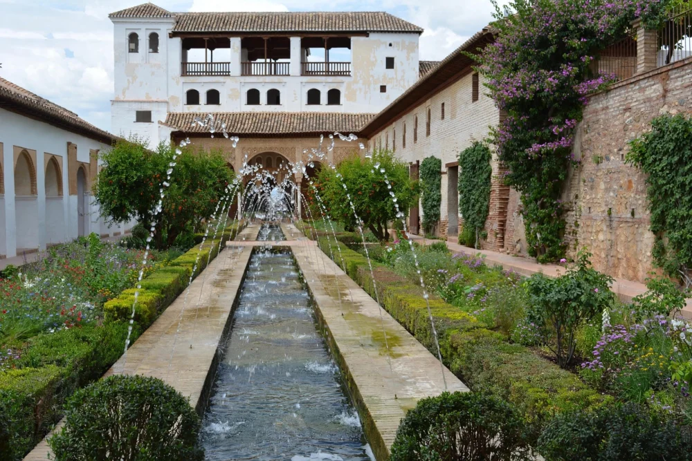 The Generalife Gardens in Granada Beautiful landscaped gardens and pergola at the Generalife in Granada, Spain
