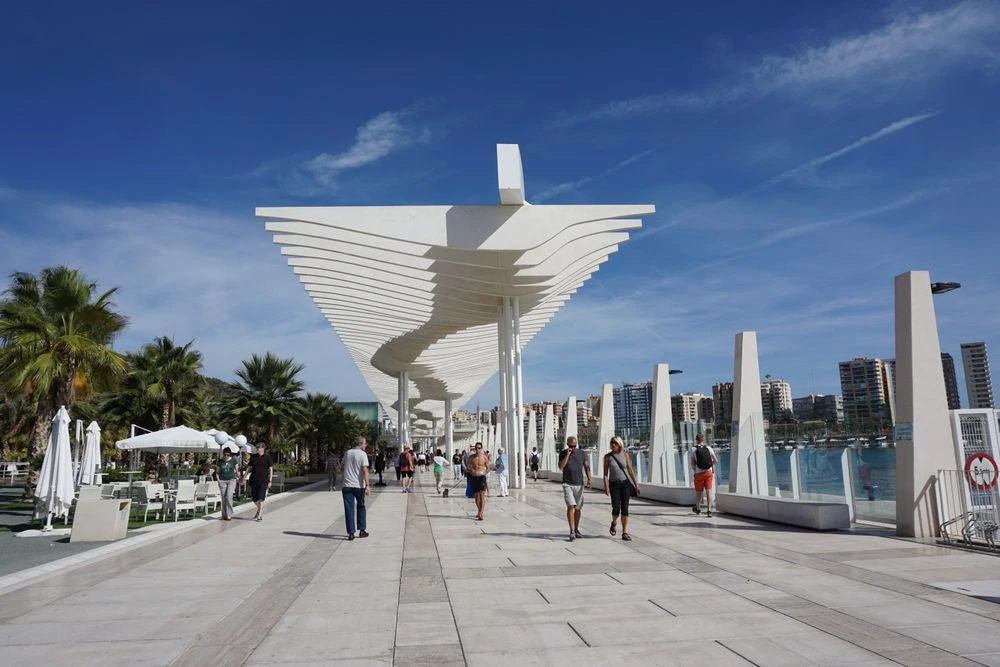 Palmeral de las Sorpresas in Málaga, Spain Palmeral de las Sorpresas in Málaga with palm trees and a waterfront promenade
