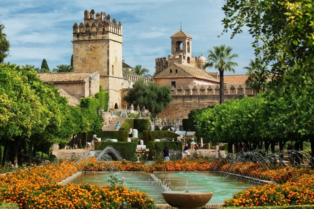 Alcázar de los Reyes Cristianos in Córdoba, Spain Alcázar de los Reyes Cristianos with historic stone towers and beautiful gardens in Córdoba, Spain
