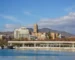 Málaga city skyline with its cathedral and Mediterranean coastline in southern Spain