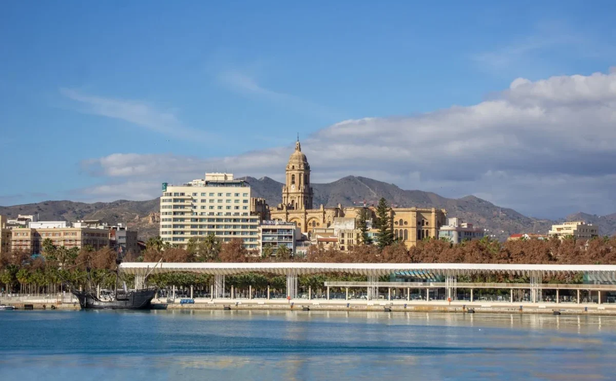 Málaga city skyline with its cathedral and Mediterranean coastline in southern Spain