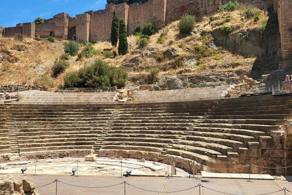 Roman Theatre of Málaga, Spain Ancient Roman Theatre of Málaga with stone seating beneath the Alcazaba fortress